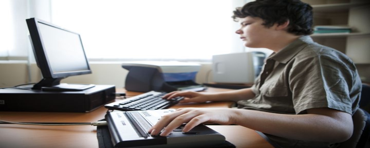 visually impaired boy surfing the web