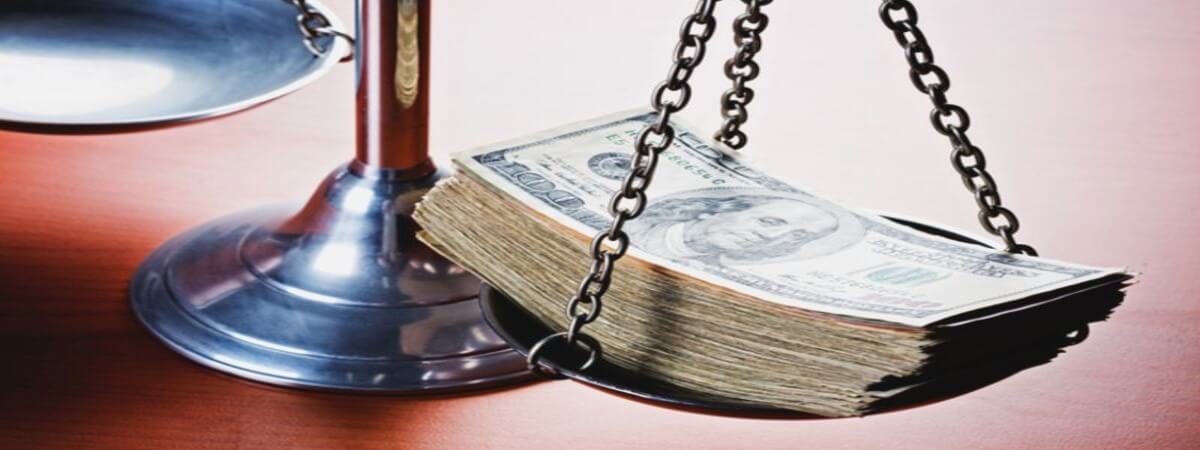 Dollar bills on a Scale of Justice