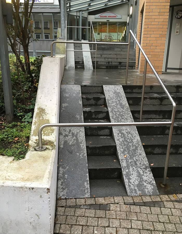 Accessibility ramp obstructed by railings