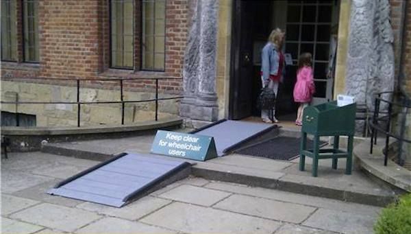 Ramp interrupted with large sign saying “keep clear for wheelchair users”